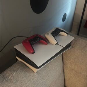 Gaming Console with Red and White Controllers